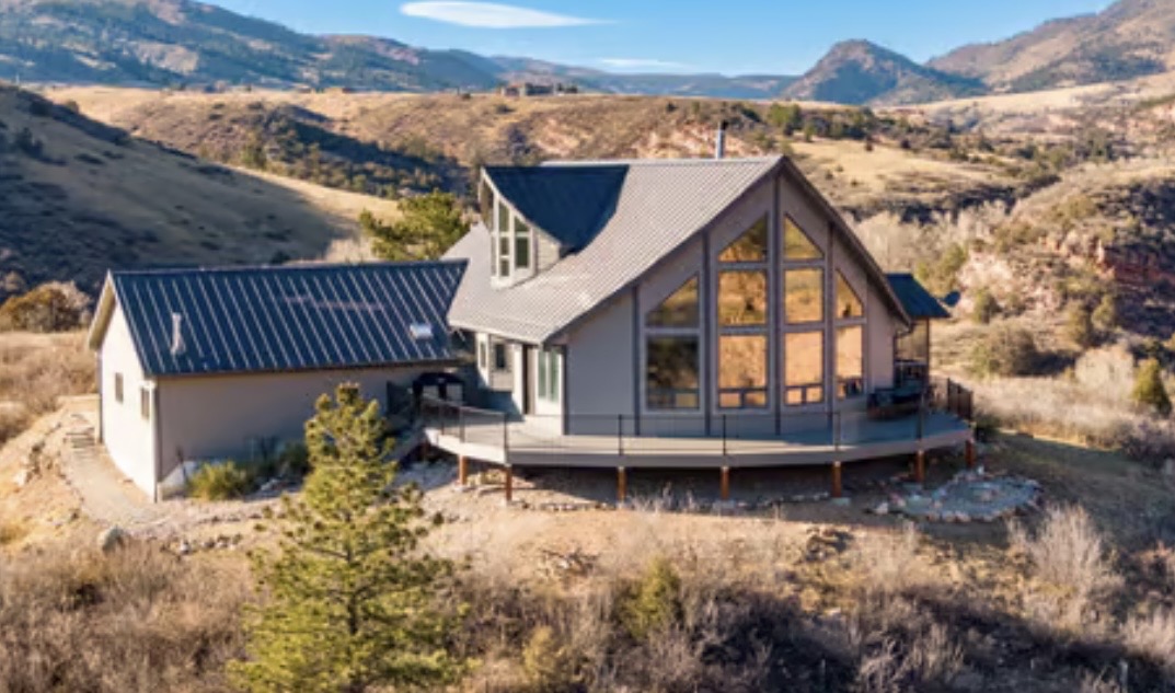 Custom A-frame mountain home with metal roof
