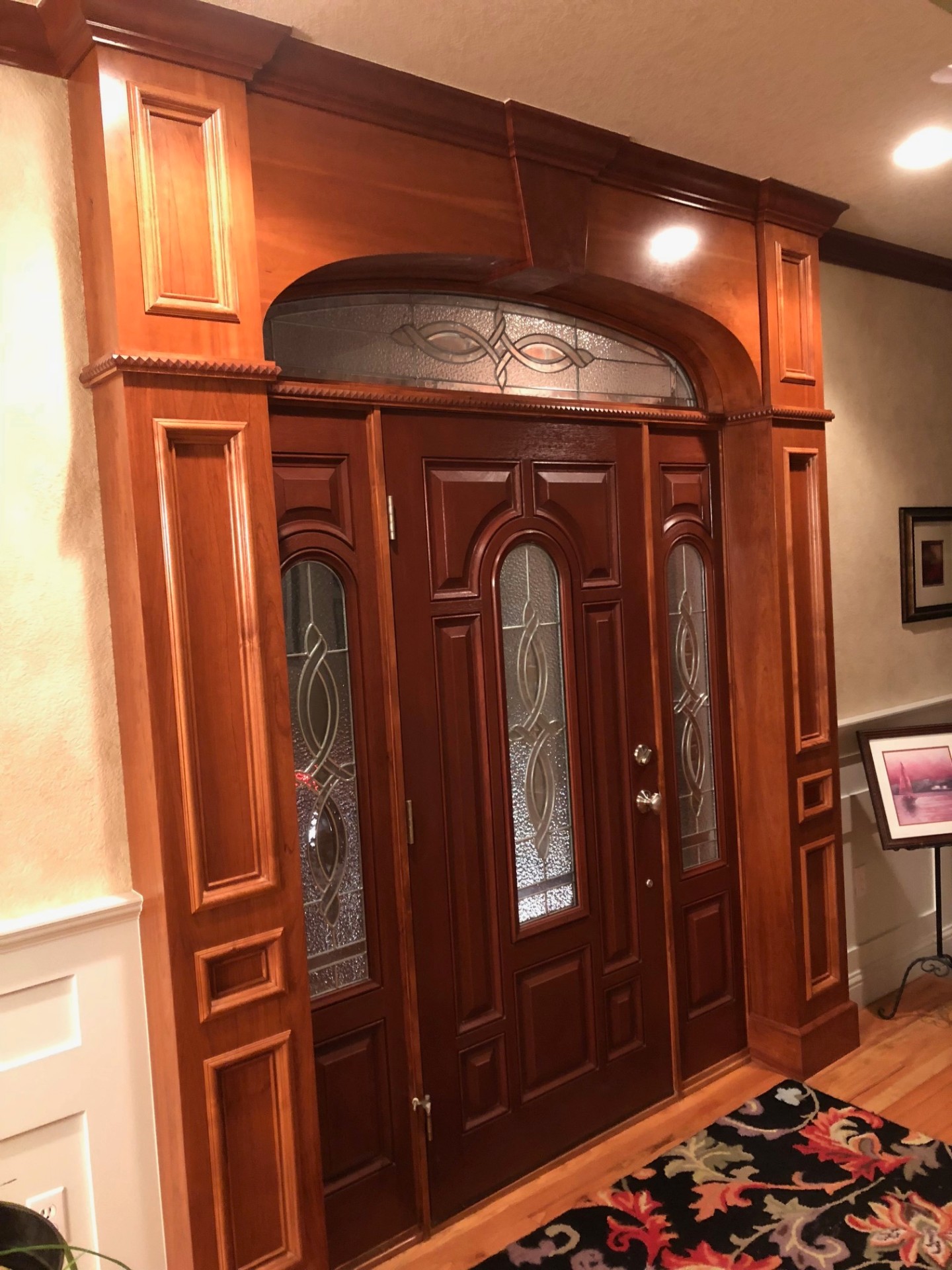Custom mahogany entry door with stained glass